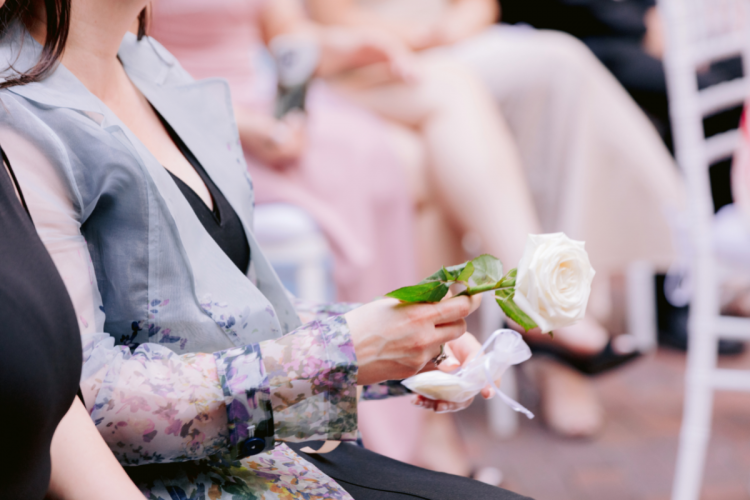 mother of groom, mother, rose, wedding ceremony, mother at wedding ceremony, brisa courtyard, grand californian