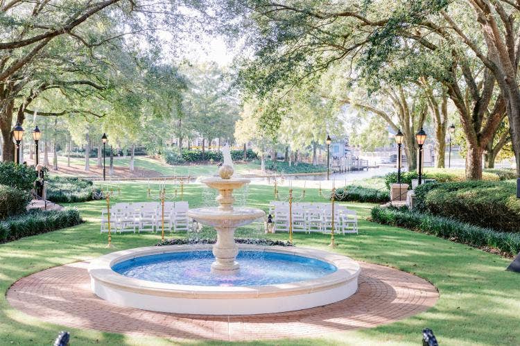 decorated wedding ceremony, wedding ceremony, ceremony, venue, port orleans, port orleans riverside, oak manor, oak manor lawn, fountain, candelabras