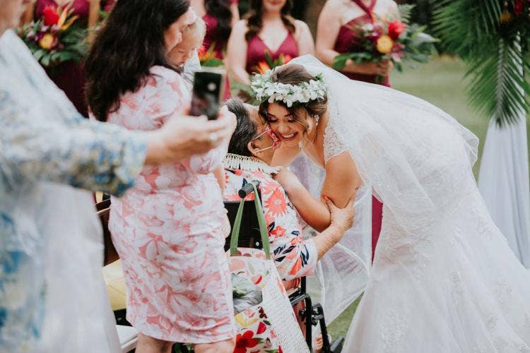 bride, candid, wedding ceremony, ceremony, aulani, aulani wedding, aulani ceremony, halawai lawn, halawai, floral, flower crown