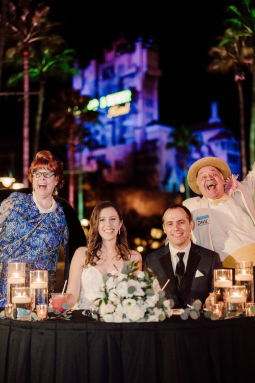 bride and groom, couple, wedding reception, reception, guest actors, uninvited guests, sweetheart table, entertainment, entertainer, hollywood studios, studios, hollywood, disney's hollywood studios, tower of terror, sunset boulevard