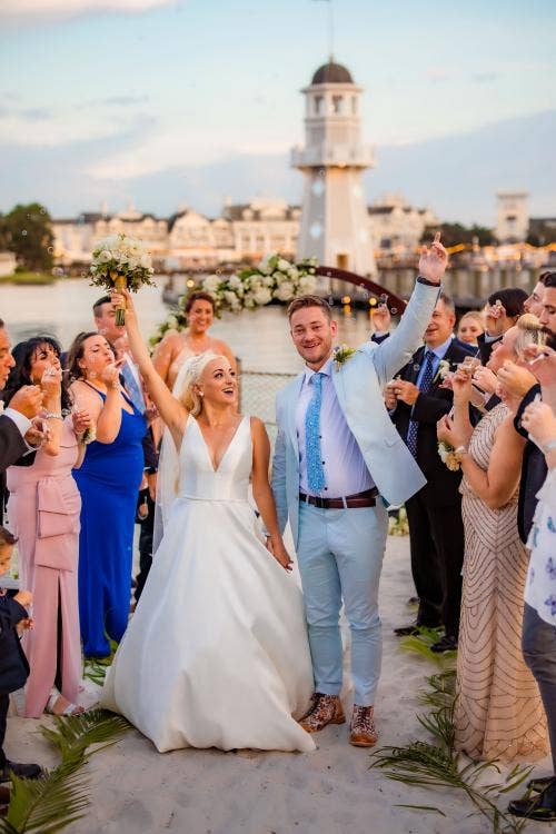 bride and groom, couple, exit, staged exit, wedding ceremony, ceremony, yacht and beach club, yacht and beach club, crescent cove, beach, waterfront