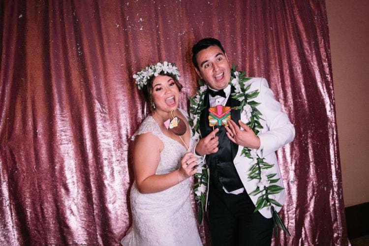 bride and groom, couple, candid, wedding reception, reception, photo booth, reception photo booth, flower crown, lei, ka'ala, ka'ala reception, ka'ala ballroom, aulani
