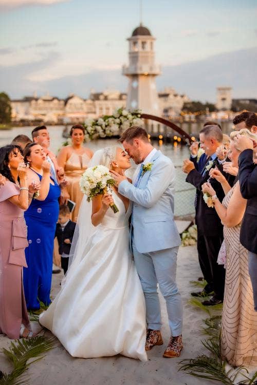 bride and groom, couple, exit, staged exit, wedding ceremony, ceremony, yacht and beach club, yacht and beach club, crescent cove, beach, waterfront