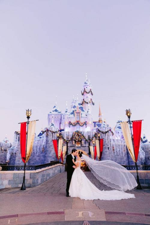 bride and groom, couple, portrait, couple portrait, Disneyland, Disneyland Park, Christmastime, sleeping beauty castle, icicle lights, castle icicle lights
