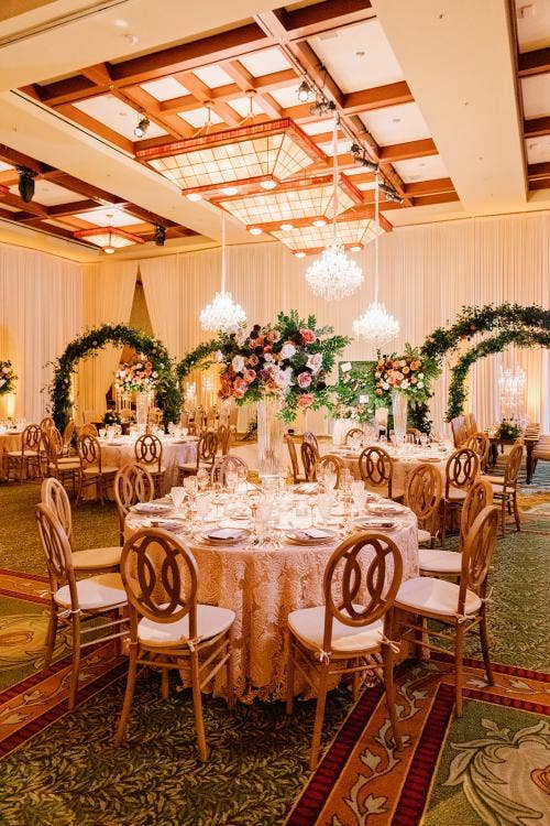 wedding reception, reception, reception decor, reception floral, boho floral, boho decor, drape, drape wall, chandeliers, floral arch, greenery wall, custom table decor, Disneyland, grand Californian, grand Californian ballroom