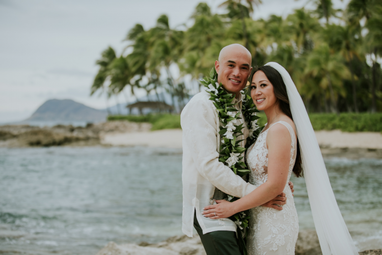 bride and groom, couple, portrait, lei, hawaiian lei, aulani, aulani couple, aulani wedding, aulani beach, beach portraits, aulani, aulani resort, aulani couple, traditional lei, hawaiian wedding