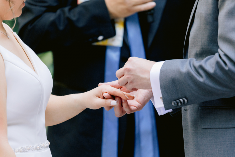 bride and groom, couple, wedding ceremony, ceremony, bride and groom at wedding ceremony, couple at wedding ceremony, rings, exchanging rings, couple exchanging rings, brisa courtyard, grand californian