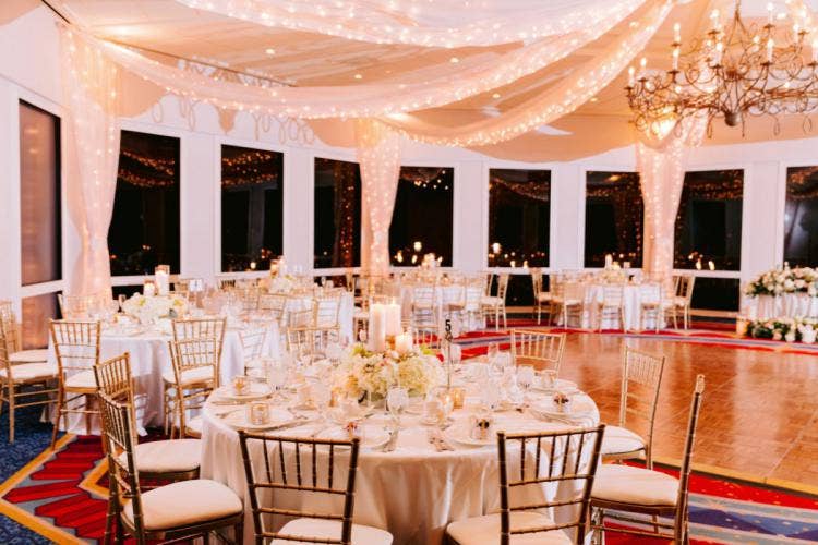 wedding reception, reception, decorated wedding reception, sleeping beauty pavilion, Disneyland, Disneyland Hotel, string lights, custom lighting, custom chairs, custom table, table decor, reception decor