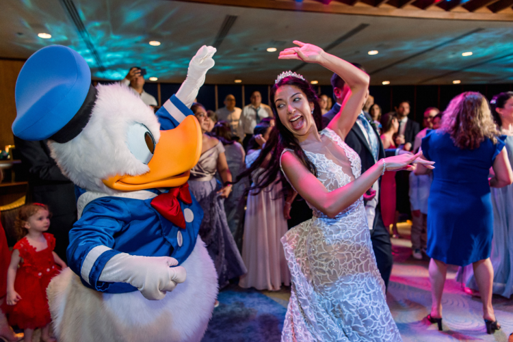 bride and groom, couple, wedding reception, reception, dancing, characters, disney characters, donald duck, pluto, living seas, living seas salon, epcot