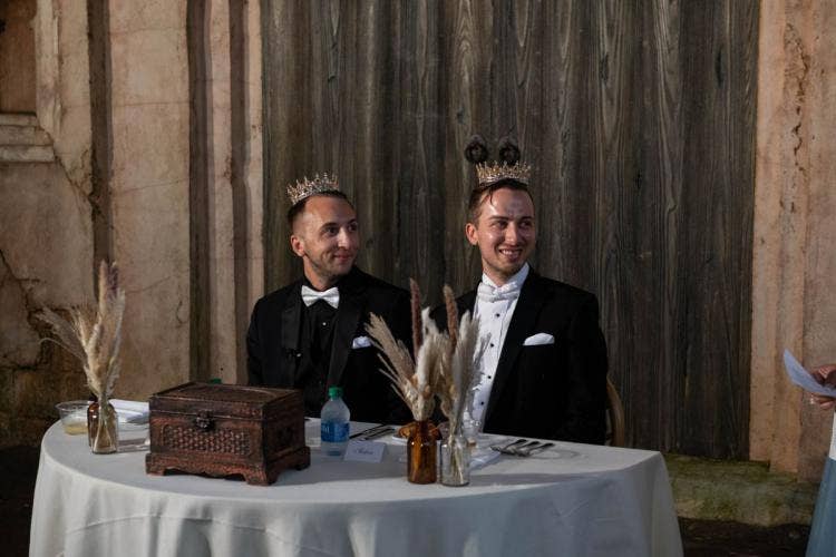 couple, groom, groom groom, lgbtq, lgbtq couple, disney's animal kingdom, animal kingdom, tamu tamu, tamu tamu courtyard, welcome reception, reception, pre-ceremony reception, sweetheart table, pompas grass