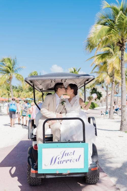 couple, transportation, golf cart, exit, transportation exit, wedding ceremony, ceremony, ceremony exit, castaway cay, Disney Cruise Line, cruise wedding