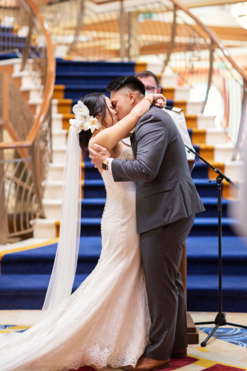bride and groom, couple, first kiss, atrium, disney cruise line, cruise, cruise line, disney cruise, cruise wedding, disney cruise line wedding, cruise line wedding, wedding ceremony, atrium ceremony, disney dream