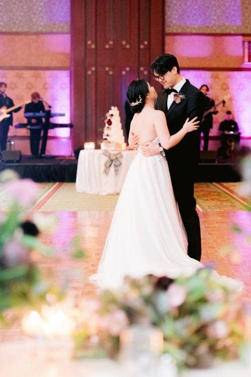 bride and groom, couple, first dance, wedding reception, reception, custom up lighting, up lighting, purple up lighting, moody aesthetic, halloween theme, grand californian, grand californian ballroom, disneyland