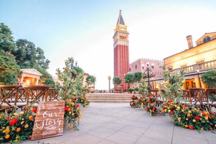 decorated wedding ceremony, wedding ceremony, ceremony, venue, decorated venue, aisle floral, aisle decor, custom chairs, EPCOT, Italy, Italy Pavilion, Italy Plaza, fall floral, fall decor, fall