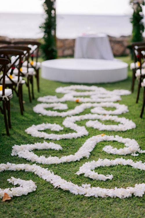 decorated wedding ceremony, ceremony, wedding ceremony, altar floral, altar arch, palm fronds, custom chairs, aisle floral, floral designs, custom aisle floral, custom floral design