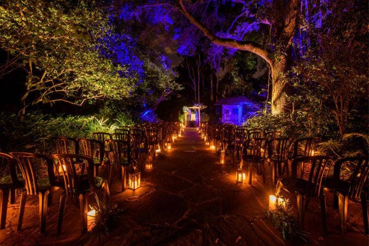 wedding ceremony, ceremony, ceremony decor, lanterns, aisle lanterns, animal kingdom, disney's animal kingdom, nighttime, belvedere, belvedere ceremony, custom up lighting, up lighting