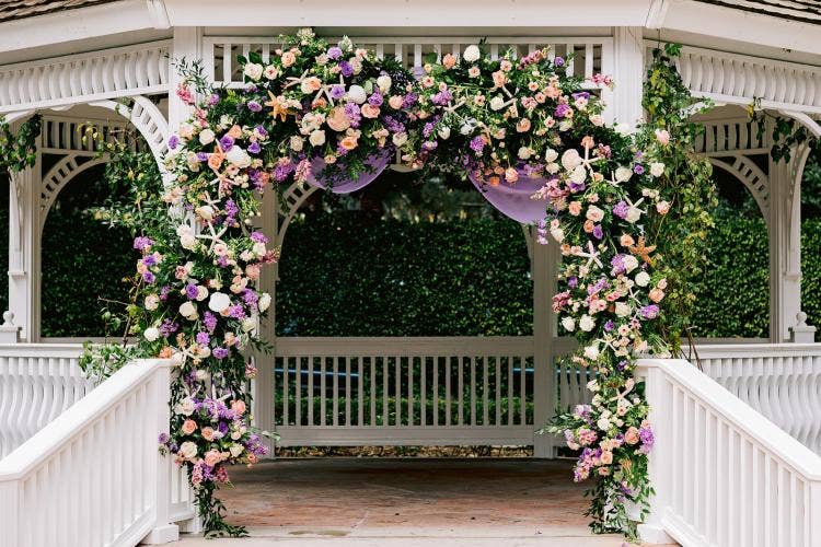 wedding ceremony, ceremony, altar area, gazebo, rose court, rose court garden, Disneyland, Disneyland Hotel, boho, boho floral, altar floral, drape, altar drape