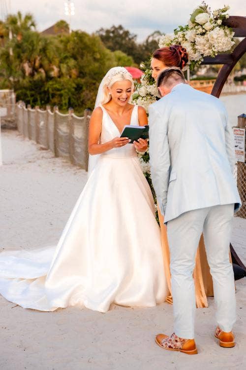 bride and groom, couple, wedding ceremony, ceremony, vows, exchanging vows, yacht and beach club, yacht and beach, crescent cove, beach, waterfront, altar area, altar arc