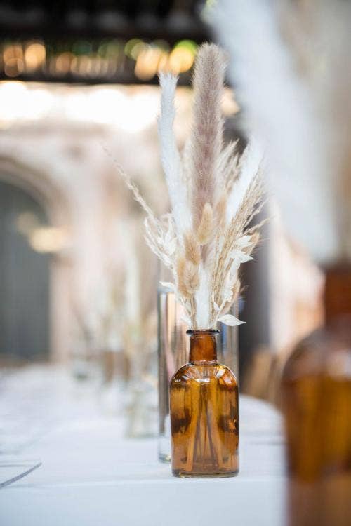 reception, reception decor, reception table, table, table decor, centerpieces, floating candles, pampas grass, boho, animal kingdom, disney's animal kingdom, tamu tamu, tamu tamu courtyard