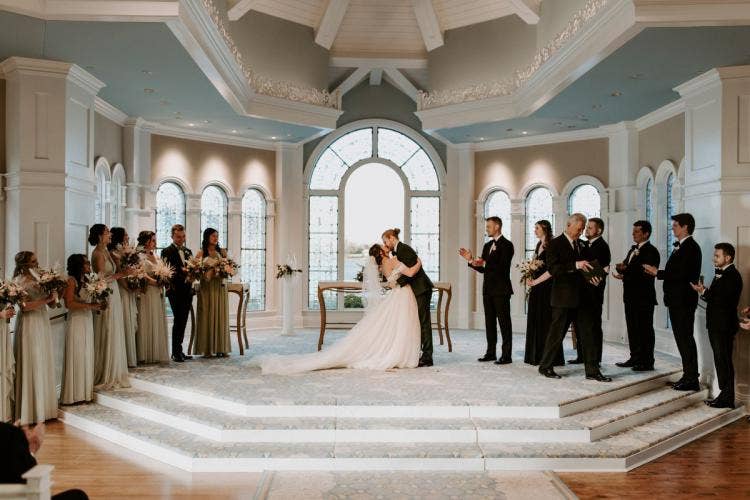 bride and groom, couple, first kiss, wedding ceremony, ceremony, Disney's wedding pavilion, wedding pavilion