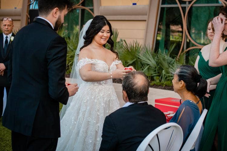 couple, serving tea, tea, tea ceremony, traditional tea ceremony, asian, Malaysian, coronado springs, coronado, Destino plaza