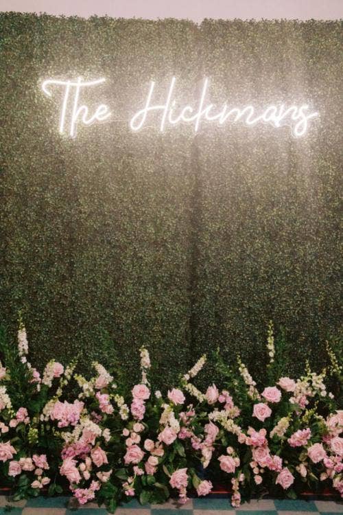 wedding reception, reception, decor, reception decor, photo wall, greenery wall, boho floral, neon sign, neon letters, Disneyland, Disneyland Hotel, sleeping beauty, sleeping beauty pavilion