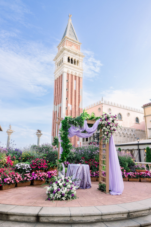 wedding ceremony, ceremony, ceremony decor, ceremony floral, altar, altar area, altar floral, epcot, italy, italy pavilion, italy plaza, purple, purple floral