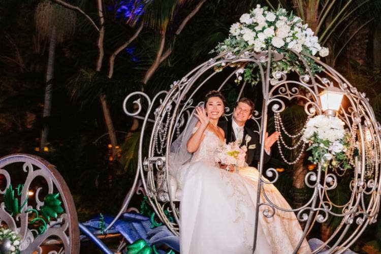 bride and groom, couple, exit, staged exit, cinderella's crystal coach, crystal coach, coach, Disneyland, Disneyland hotel, rose court, rose court garden