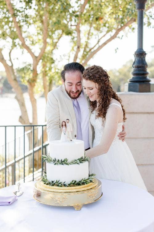 couple, cutting cake, wedding cake, cake, food, reception, reception food, wedding reception, Epcot, France, France Pavilion, terrace des fleurs