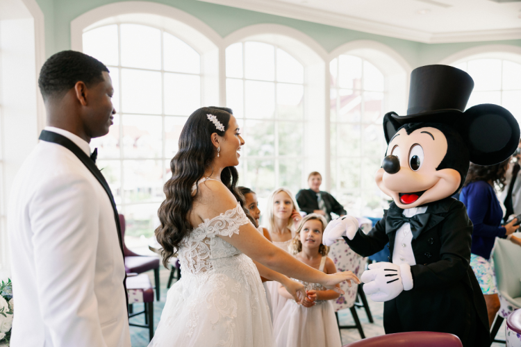 bride and groom, couple, candid, entertainment, character, Mickey Mouse, reception, wedding reception, Disney's grand Floridan resort & spa, grand Floridian, citricos