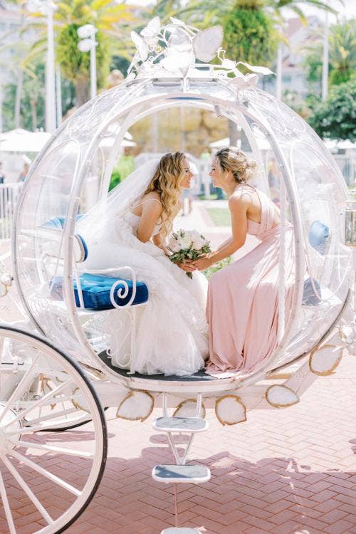 bride, bride and sister, bridal party, entrance, ceremony entrance, wedding ceremony, ceremony, cinderella's coach, coach, Disney's wedding pavilion, wedding pavilion