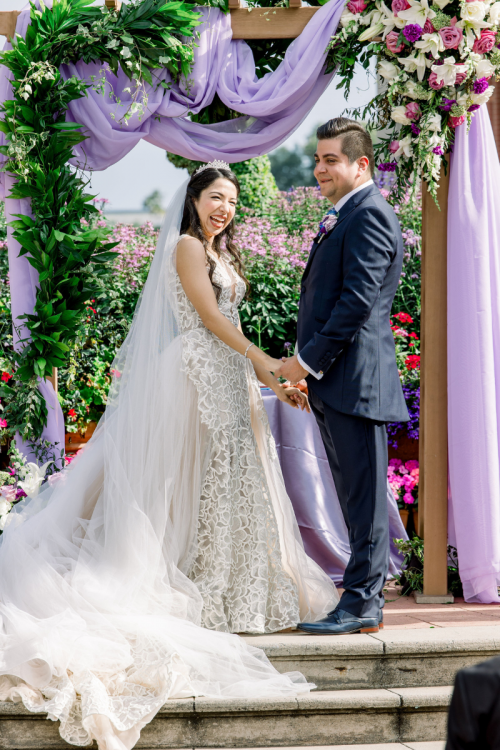bride and groom, couple, wedding ceremony, ceremony, altar area, altar, candid, vows, epcot, italy, italy pavilion, italy plaza