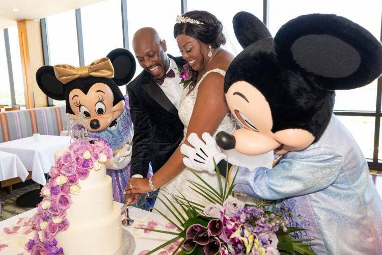 bride and groom, couple, cutting cake, wedding cake, cake, dessert, mickey and minnie, characters, entertainment, contemporary, contemporary resort, california grill