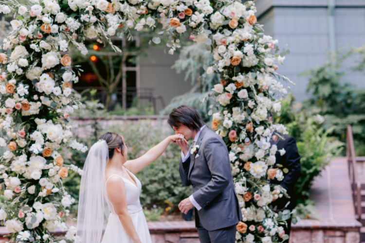 bride and groom, couple, wedding ceremony, ceremony, bride and groom at wedding ceremony, couple at wedding ceremony, rings, exchanging rings, couple exchanging rings, brisa courtyard, grand californian