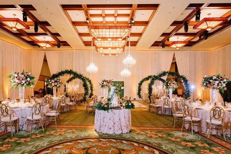 wedding reception, reception, reception decor, reception floral, boho floral, boho decor, drape, drape wall, chandeliers, floral arch, greenery wall, custom table decor, Disneyland, grand Californian, grand Californian ballroom