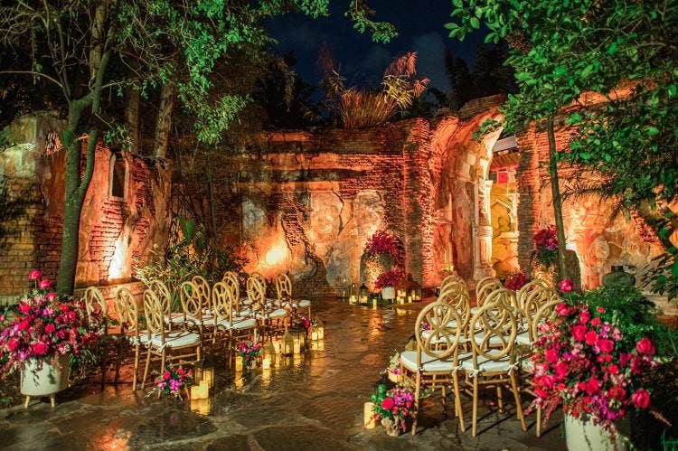 decorated wedding ceremony, wedding ceremony, ceremony, venue, ceremony venue, custom aisle decor, aisle floral, candles, aisle candles, custom chairs, animal kingdom