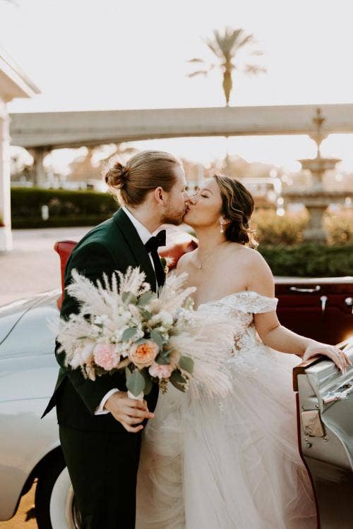 bride and groom, couple, portrait, transportation, vintage car, car, motorcar, boho floral, floral