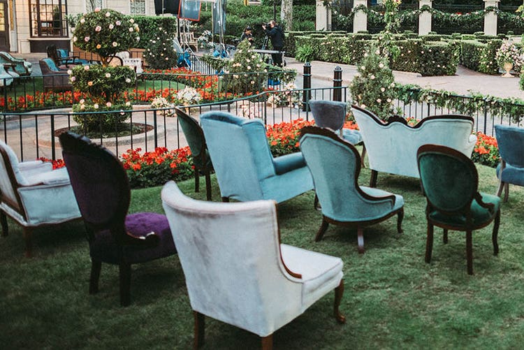 Traditional and antique chairs set-up in a garden