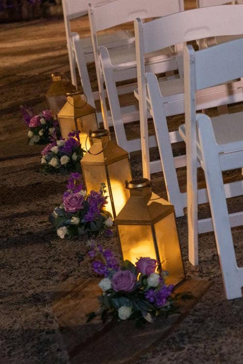 wedding ceremony, ceremony, ceremony decor, ceremony floral, aisle decor, aisle floral, lanterns, purple floral, aisle lanterns