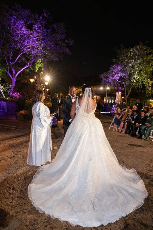 bride and groom, couple, candid, wedding ceremony, ceremony, vows, exchanging vows, animal kingdom, disney's animal kingdom, tree of life, tree of life ceremony