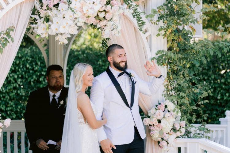 bride and groom, couple, candid, wedding ceremony, ceremony, Disneyland, Disneyland Hotel, rose court, rose court garden