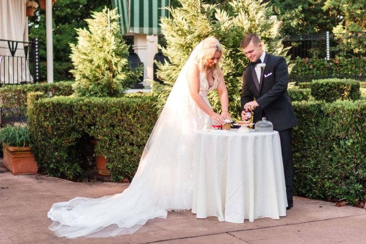 bride and groom, couple, wedding ceremony, ceremony, Epcot, uk, uk courtyard, uk pavilion, unity ceremony, sandwich unity ceremony