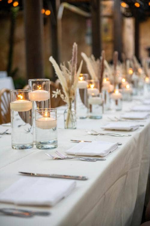 reception, reception decor, reception table, table, table decor, centerpieces, floating candles, pampas grass, boho, animal kingdom, disney's animal kingdom, tamu tamu, tamu tamu courtyard