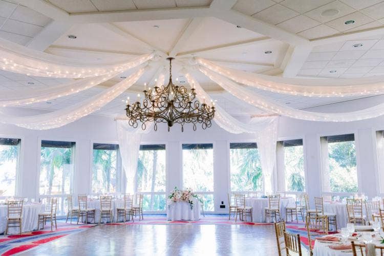 decorated wedding reception, reception, wedding reception, fairy lights, string lights, table rounds, boho decor, Disneyland, Disneyland Hotel, sleeping beauty, sleeping beauty pavilion