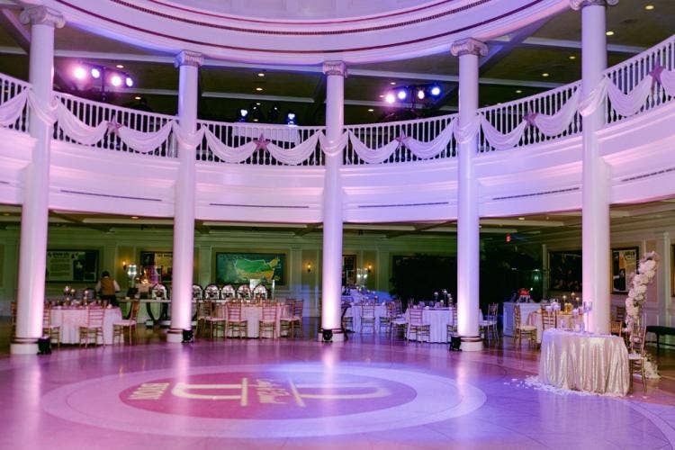 decorated wedding reception, reception, wedding reception, custom up lighting, up lighting, table rounds, custom chairs, Chiavari chairs, aa rotunda, American adventure rotunda, Epcot, America pavilion