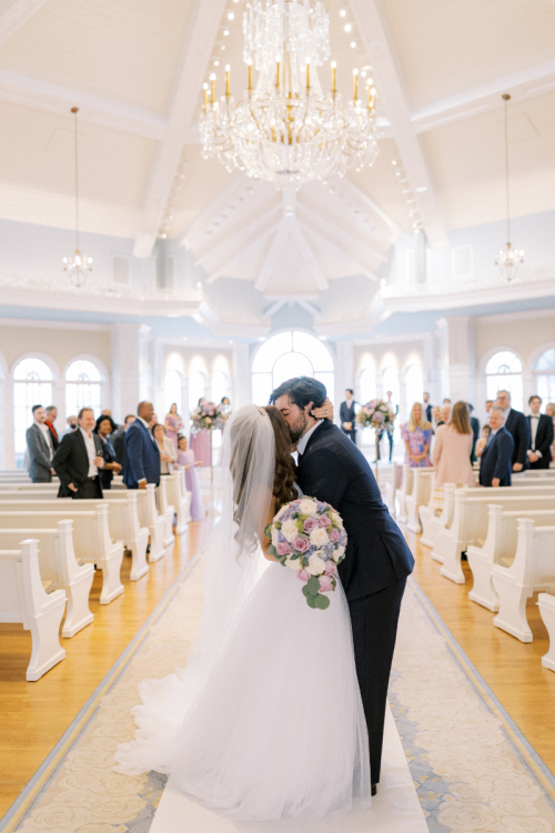 bride and groom, first kiss, wedding ceremony, classic fairy tale wedding, disney wedding pavilion, disney wedding, wedding ceremony kiss