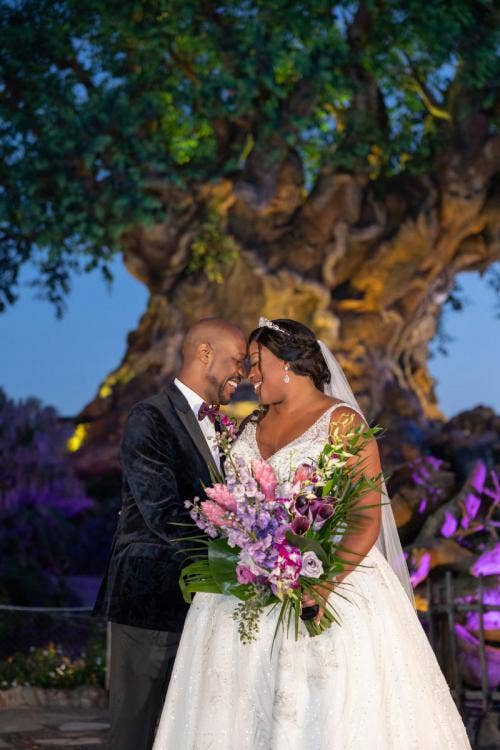 bride and groom, couple, portrait, couple portrait, animal kingdom, disney's animal kingdom, tree of life, bouquet, bridal bouquet, tropical floral, tropical bridal bouquet