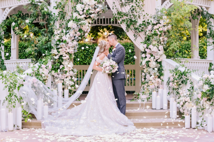 bride and groom, couple, wedding ceremony, ceremony, candid, kiss, first kiss, rose court garden, rose court, disneyland, disneyland hotel, wedding ceremony, ceremony, ceremony kiss