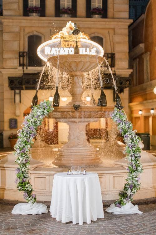 wedding ceremony, venue, ceremony venue, decorated ceremony, Epcot, france pavilion, place de Remy, altar area, altar arch, floral arch