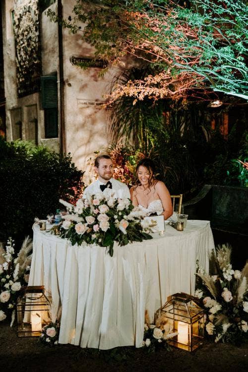 bride and groom, couple, wedding reception, reception, sweetheart table, floral, reception floral, table decor, table floral, Disney's animal kingdom, animal kingdom